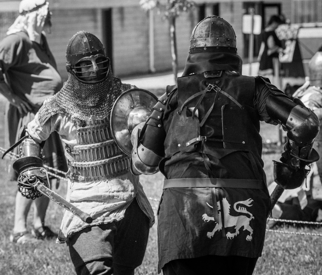black & white image of two SCA fighters in armour
